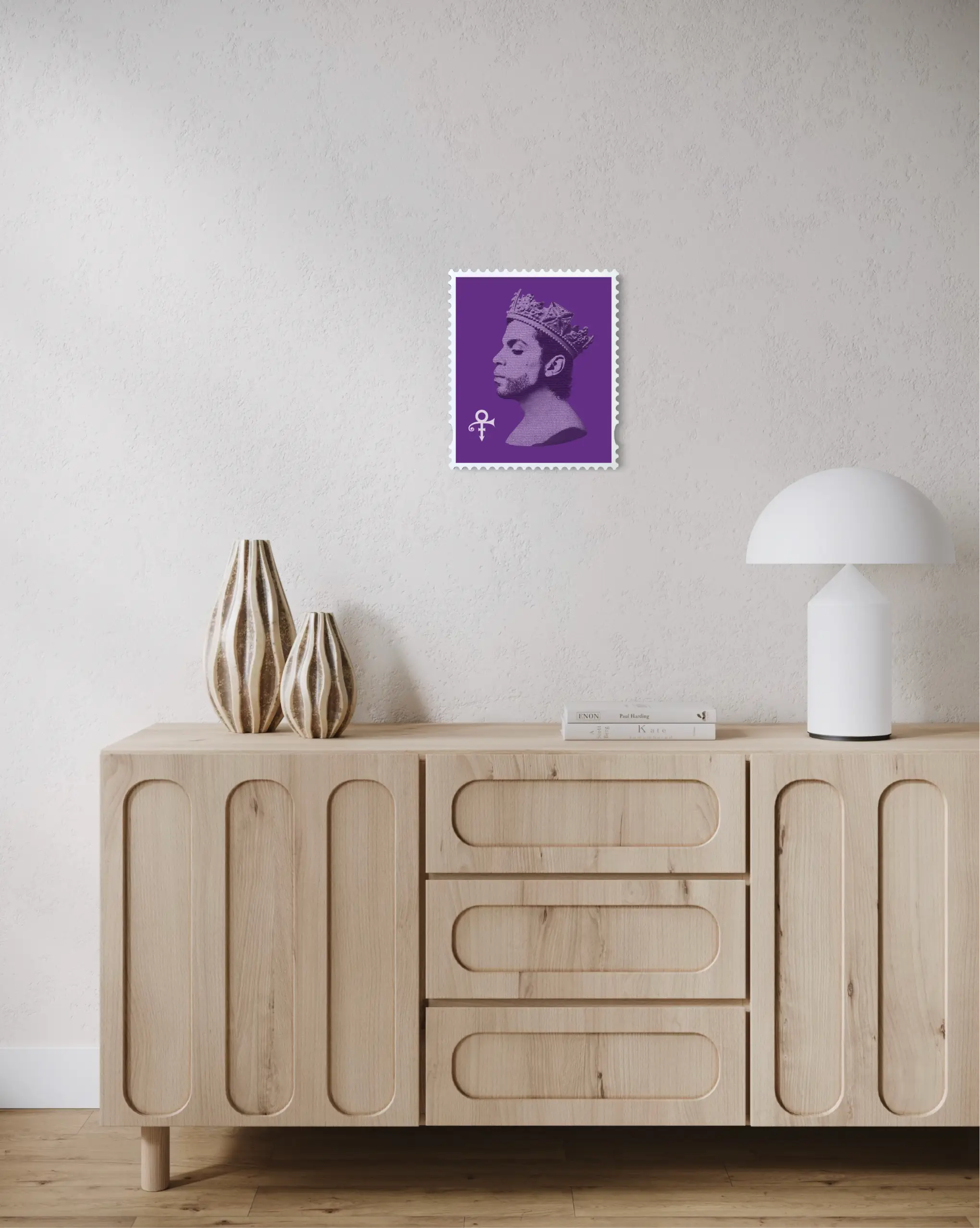 Prince Purple Reign limited edition framed stamp artwork displayed above a natural oak sideboard in a minimal hallway with neutral walls. #size_Medium