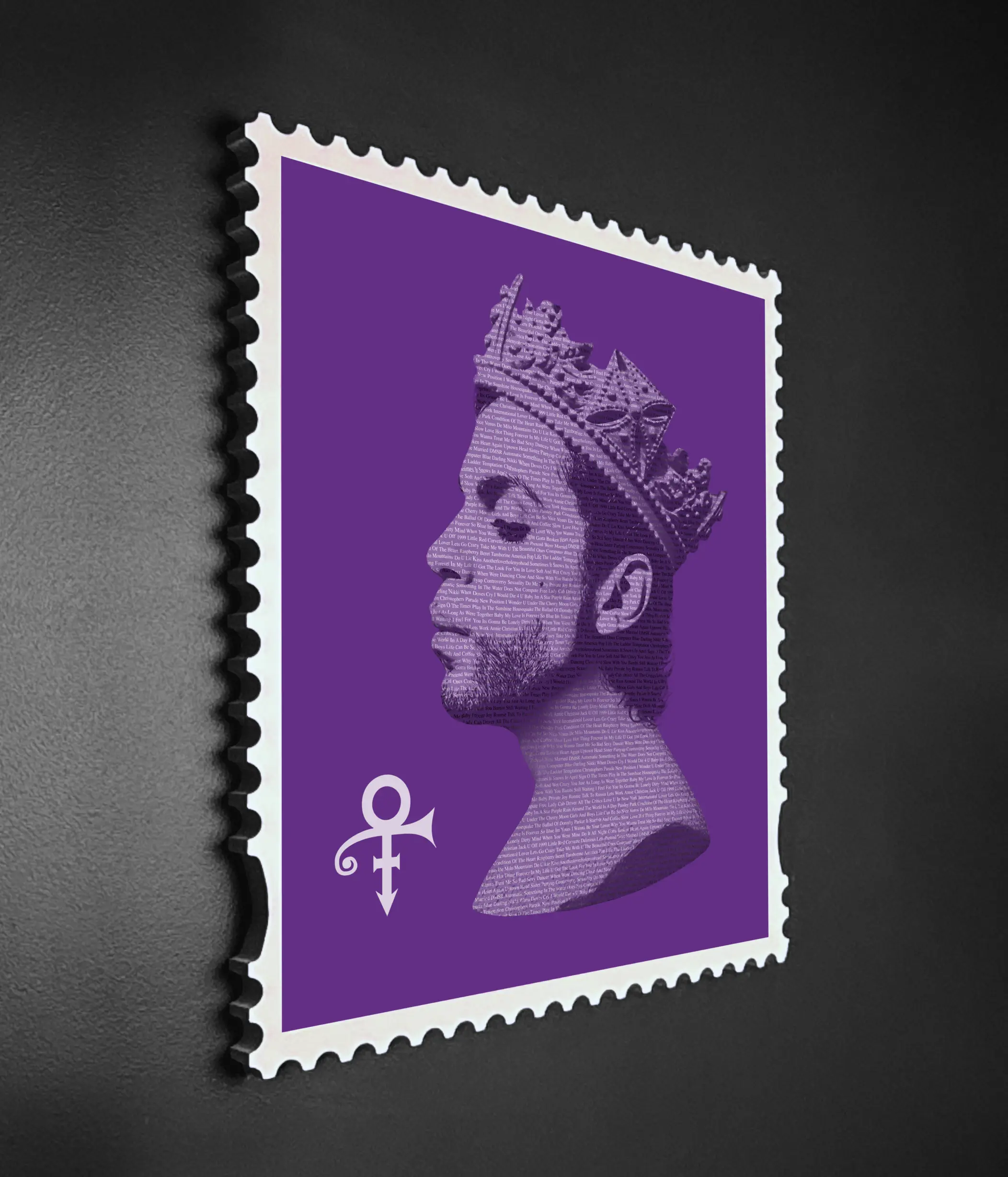 Side angle view of a framed Prince stamp-style typography artwork showing depth and structure of the handmade wooden frame and layered design