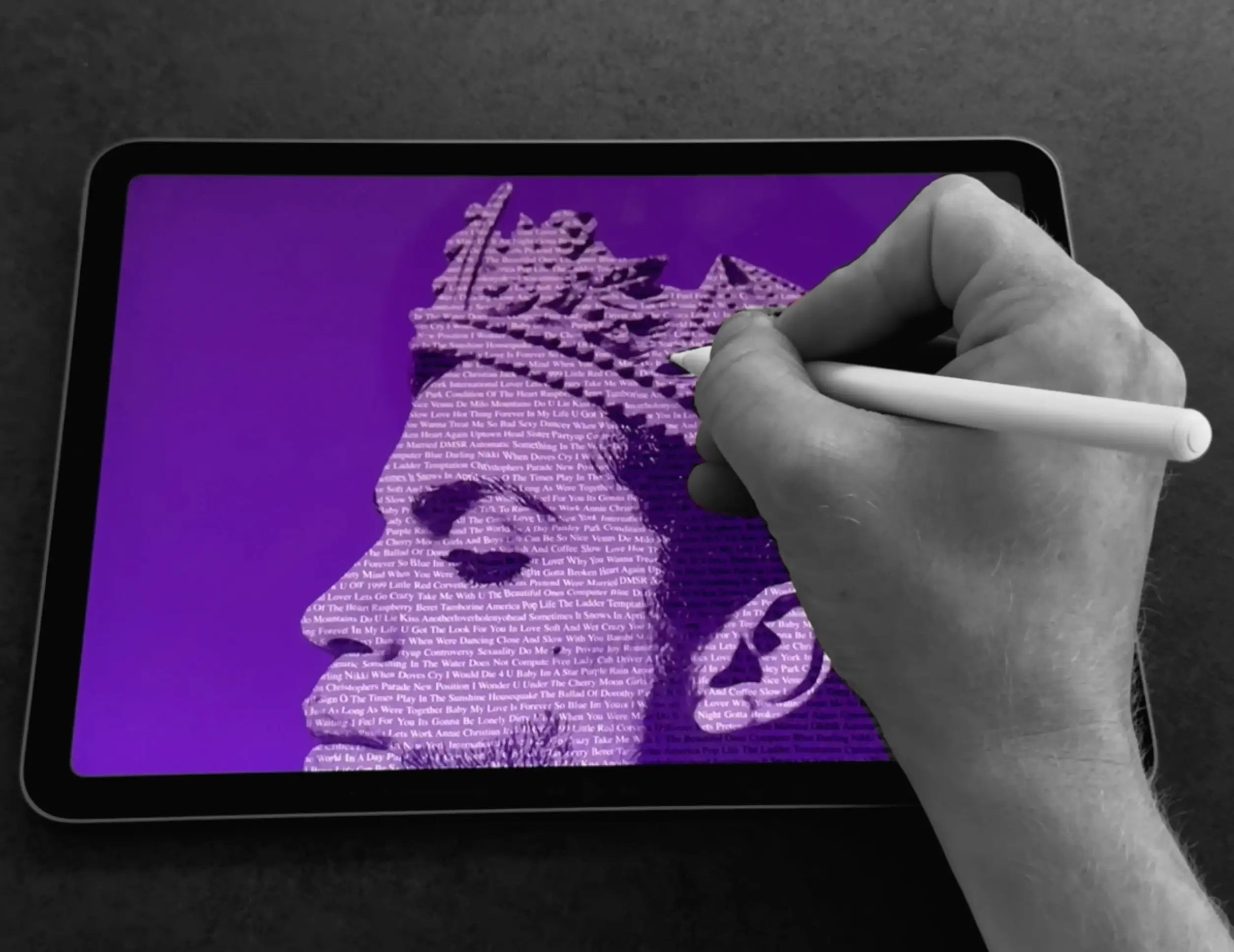 Hand creating a Prince typography artwork on an iPad during the digital design process, showing the development of the portrait from song title typography