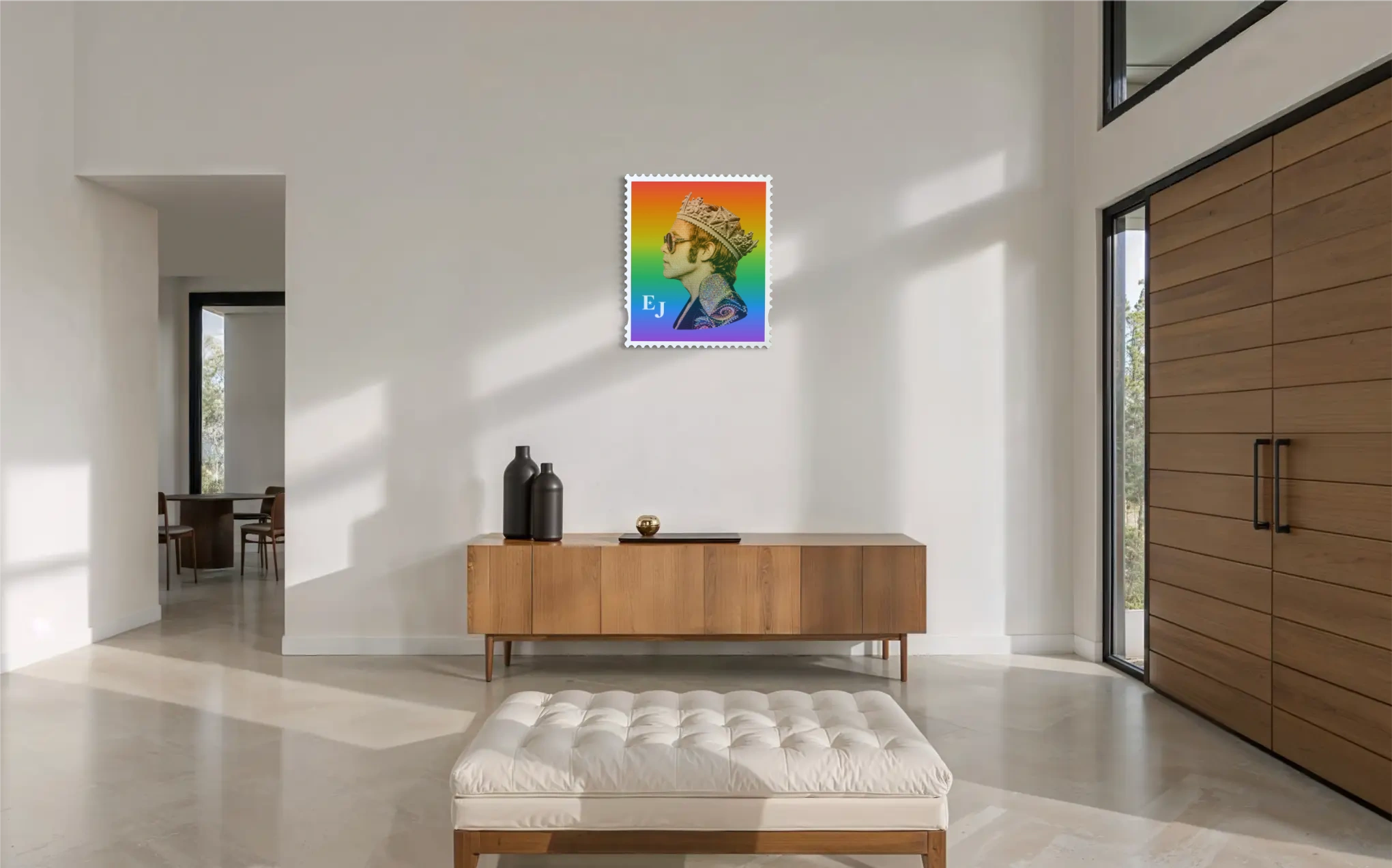Elton John Rocket King limited edition framed stamp artwork displayed in a sunlit white entrance hall above a wooden sideboard. #size_large