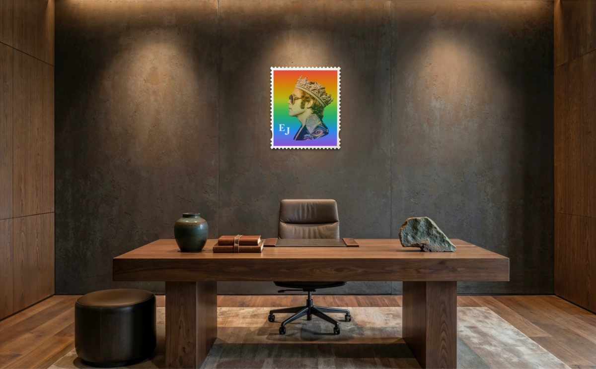 Elton John Rocket King limited edition framed stamp artwork displayed above a walnut desk in a spotlit concrete office. #size_large