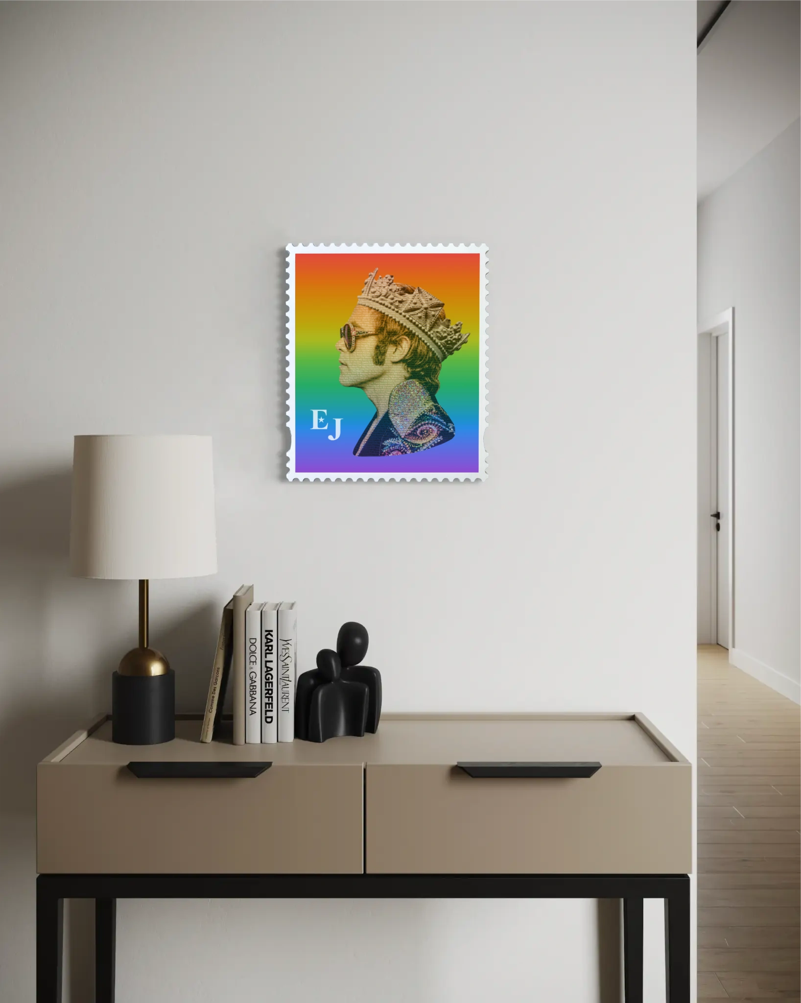 Elton John Rocket King limited edition framed stamp artwork displayed on a white hallway wall above a console table with fashion books. #size_medium