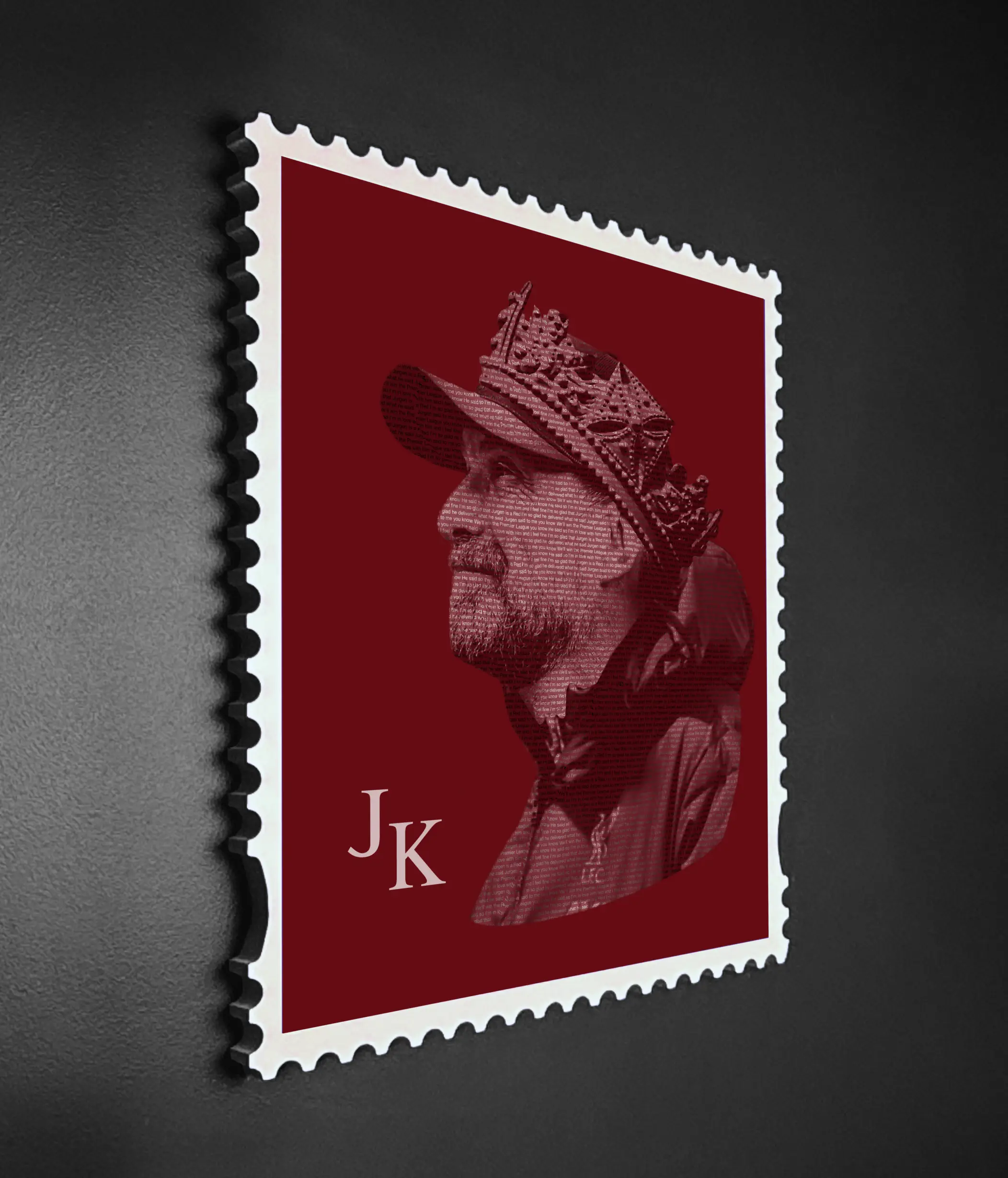 Jurgen Klopp quote typography stamp portrait in deep red shown at an angle, revealing the depth and craftsmanship of the handmade wooden stamp frame against a dark background.