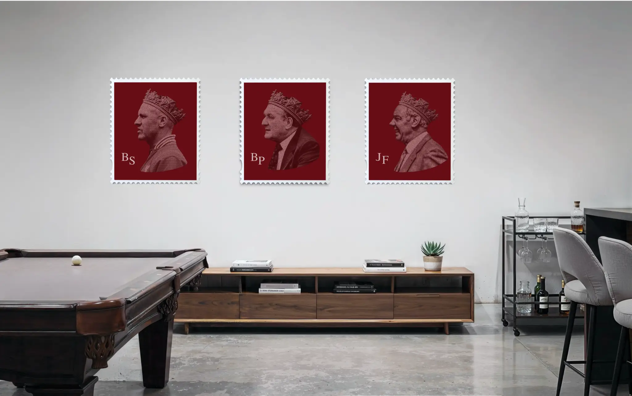 Three large Liverpool FC manager stamp artworks – Bill Shankly, Bob Paisley, and Joe Fagan – displayed as a set on a white wall in a modern games room with a pool table, walnut media unit, bar trolley, and concrete flooring, demonstrating the Liverpool Legends collection as a gallery-style feature wall. #size_large