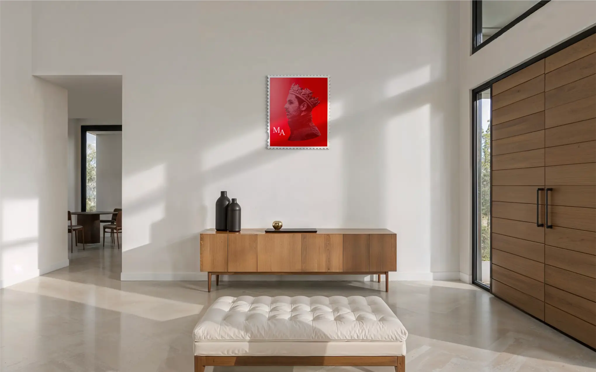Mikel Arteta limited edition stamp artwork displayed on white wall above a wooden sideboard in a bright modern hallway interior setting. #size_large