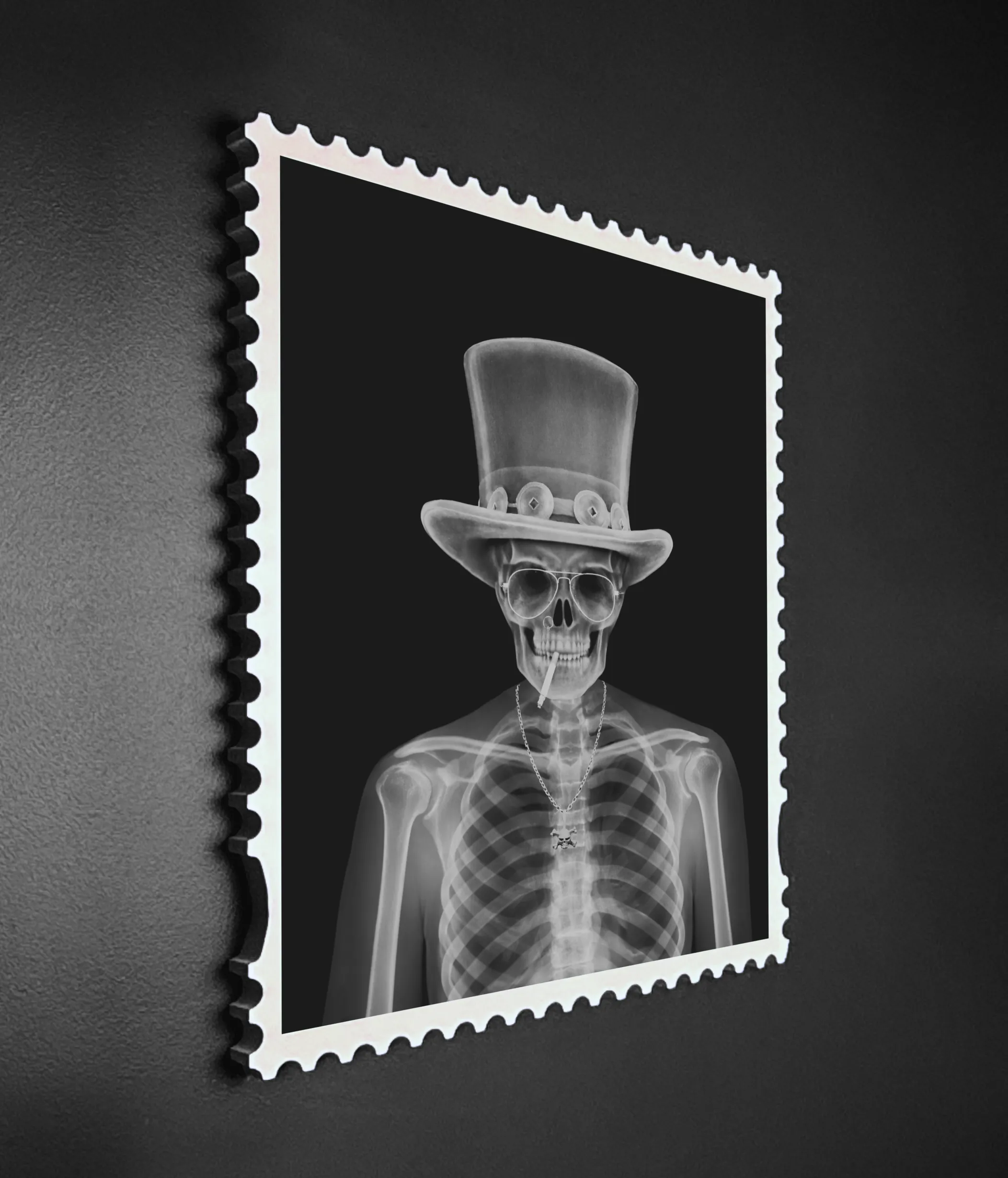 Angled wall-mounted view of the Slash Skin & Bones lenticular artwork showing the X-ray skeleton state – monochrome image in a postage stamp frame mounted on a dark textured wall.